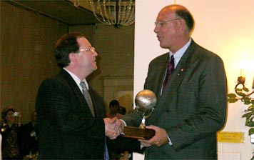 Photograph of Barry McCool accepting award.