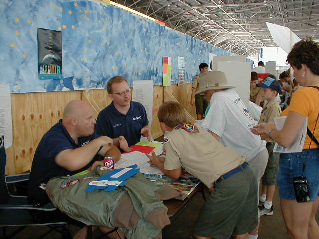 photograph of OASIS volunteers Bill Ernoehazy and Steve Bartlett talk to scouts about space careers.