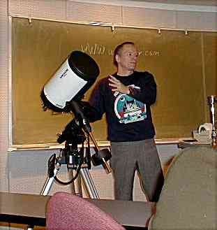 Photo of Mike Weasner demostrating telescope operations.