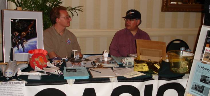 Steve Bartlett and Bob Gounley at OASIS LonCon table.