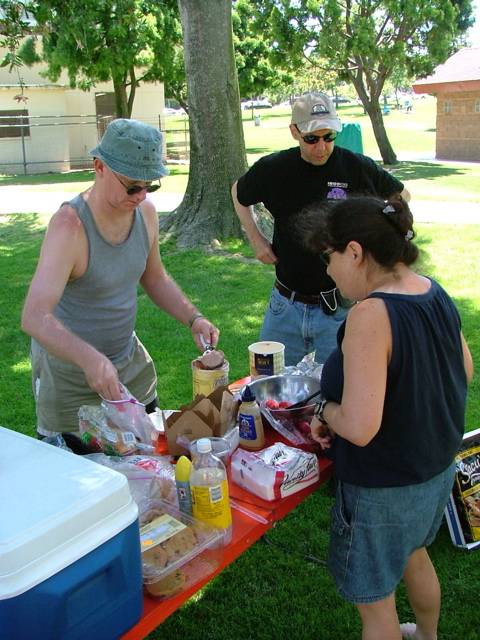 Dishing out goodies at the picnic.