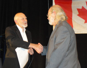 Professor Don Flournoy (left) congratulates second-prize winner Royce Jones. (Photo: Seth Potter)