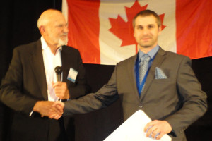 Professor Don Flournoy (left) congratulates second-prize winner Cory Bergsrud. (Photo: Seth Potter)