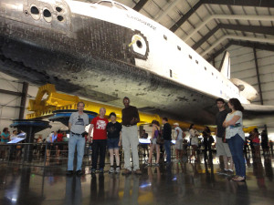 Even tall Ivor Dawson (center of photograph) is dwarfed by the Endeavour! Going left from Ivor - Lisa Kaspin-Powell, Gareth Powell and Seth Potter. The visit took place after the OASIS Summer Picnic, July 2014.