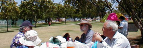 Members enjoy the park at the OASIS Summer Picnic Potluck.